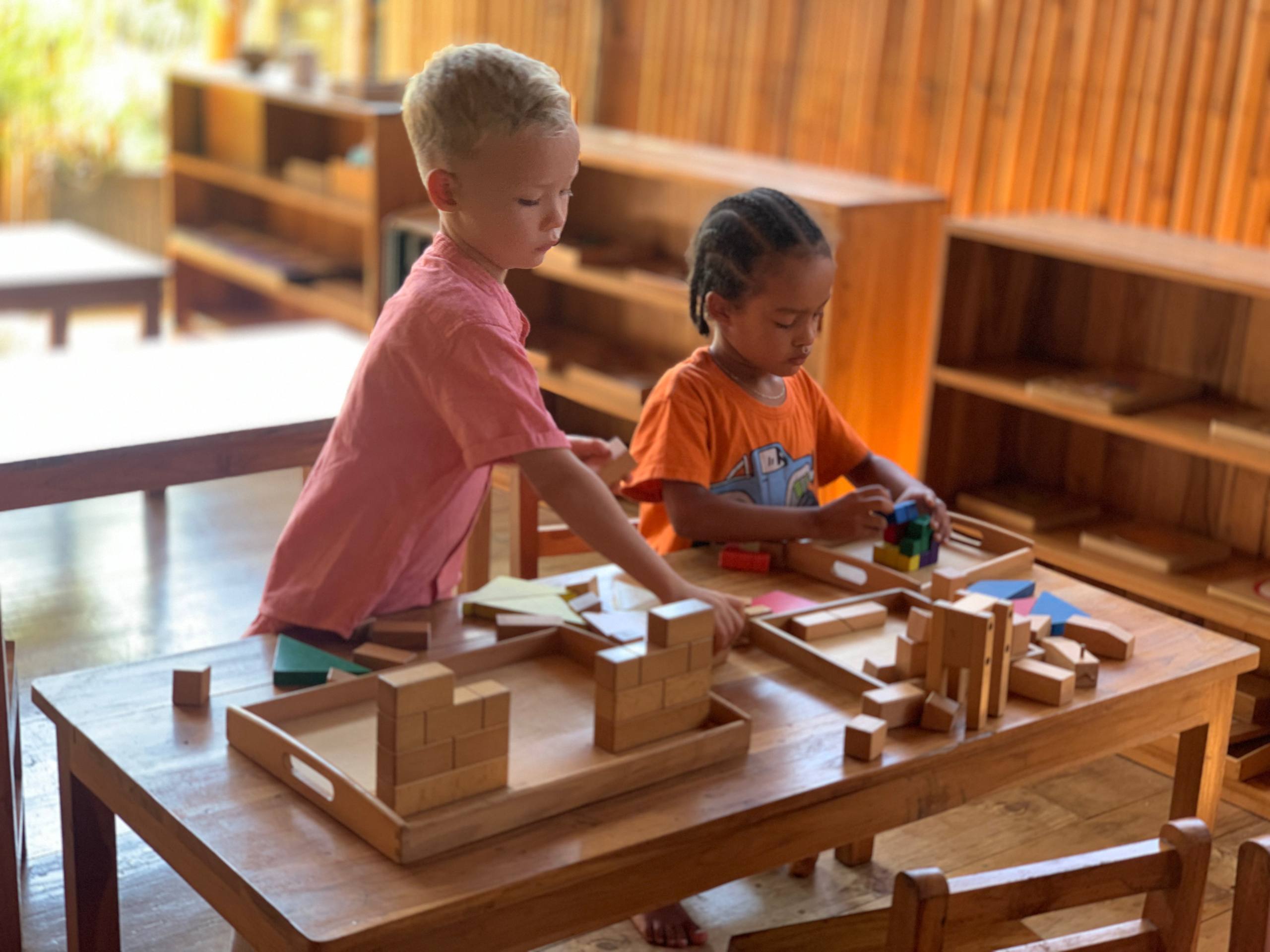 A Montessori classroom at Balu Kids with materials on open shelves
